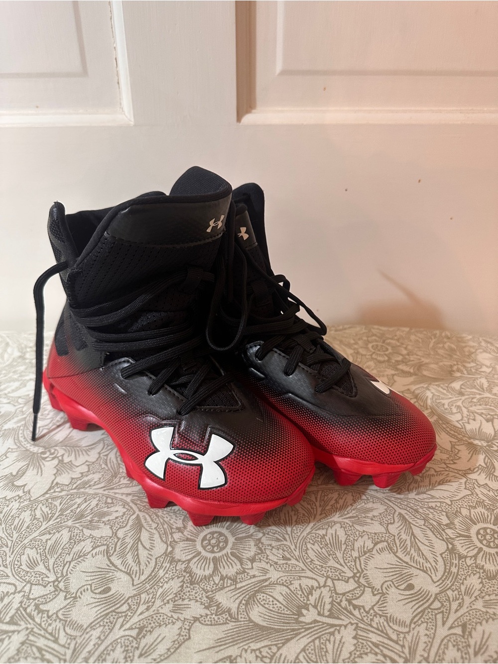 Under Armour Kids' Red and Black football Cleats